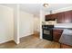 A kitchen featuring modern appliances and laminate flooring at 919 Chester St, Durham, NC 27701