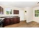 A kitchen with dark wood cabinets and laminate flooring at 919 Chester St, Durham, NC 27701