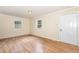 Bright living room with neutral walls, wood-look floors, and plenty of natural light at 919 Chester St, Durham, NC 27701
