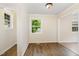 Bright living room with windows and hardwood floors at 919 Chester St, Durham, NC 27701
