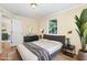 Staged main bedroom with bed, dresser, and decor at 919 Chester St, Durham, NC 27701
