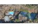 An aerial photograph shows the community pool and tennis courts surrounded by trees at 101 Turnberry Ln, Cary, NC 27511
