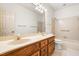 Traditional bathroom featuring double sink vanity and tub/shower combination at 101 Turnberry Ln, Cary, NC 27511