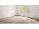 Neutral bedroom featuring carpet, bright natural light, and a simple design at 101 Turnberry Ln, Cary, NC 27511