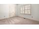 Neutral bedroom with carpet, window, and double door closet at 101 Turnberry Ln, Cary, NC 27511