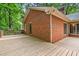 Spacious wooden deck offers ample room for outdoor enjoyment and entertaining, adjacent to the brick home at 101 Turnberry Ln, Cary, NC 27511