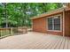 Expansive wooden deck, perfect for outdoor living, with a lush backyard backdrop at 101 Turnberry Ln, Cary, NC 27511