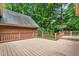Spacious wooden deck providing serene view of the surrounding lush greenery at 101 Turnberry Ln, Cary, NC 27511