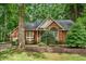 Charming brick home with manicured landscaping and mature trees, creating curb appeal at 101 Turnberry Ln, Cary, NC 27511