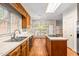 Spacious kitchen featuring an island cooktop, lots of counter space, and hardwood flooring at 101 Turnberry Ln, Cary, NC 27511
