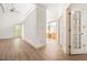 Open living room with ceiling fan and views into the kitchen and dining area at 101 Turnberry Ln, Cary, NC 27511