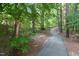 The walking trail winds through the forest offering a peaceful place to stroll at 101 Turnberry Ln, Cary, NC 27511