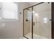 Bathroom with glass-enclosed tile shower with window at 105 Blue Prince Trl, Holly Springs, NC 27540