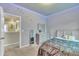 Bedroom featuring gray walls, carpet floors, a window, accent lighting, and light gray furniture at 111 S Rose Hill Dr, Clayton, NC 27520