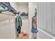 Organized walk-in closet with metal shelving, hanging clothes, and storage bins, offering ample storage space at 111 S Rose Hill Dr, Clayton, NC 27520