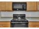 Close-up of modern kitchen appliances including microwave, oven, and a stainless steel teapot at 111 S Rose Hill Dr, Clayton, NC 27520
