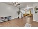Open living space with hardwood floors, neutral walls, carpeted stairs, and view of the living room at 111 S Rose Hill Dr, Clayton, NC 27520