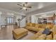 Inviting living room showcases a sprawling corduroy sofa with plush ottoman and wood-look flooring at 111 S Rose Hill Dr, Clayton, NC 27520