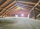 A large attic with exposed wood beams and a bright window at 112 Saddletree Rd, Oxford, NC 27565