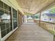 Expansive back porch, ideal for relaxing and enjoying the outdoors with backyard views at 112 Saddletree Rd, Oxford, NC 27565