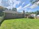 Lush backyard featuring a classic brick exterior with a cozy porch and a well-manicured lawn at 112 Saddletree Rd, Oxford, NC 27565