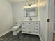 Bright bathroom with a large vanity and a glimpse into a modern, tiled shower at 112 Saddletree Rd, Oxford, NC 27565
