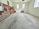 Spacious garage with two windows, wooden cabinets, and stairs with metal railings at 112 Saddletree Rd, Oxford, NC 27565