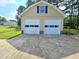 Detached two-car garage painted a complementary color to the house, and with plenty of room for vehicles at 112 Saddletree Rd, Oxford, NC 27565