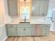 Updated kitchen features granite countertops, subway tile backsplash and sleek stainless steel appliances at 112 Saddletree Rd, Oxford, NC 27565