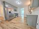 Well-lit kitchen with stainless steel appliances and wooden floors adds warmth and style at 112 Saddletree Rd, Oxford, NC 27565