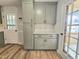 Kitchen with shaker cabinets and granite countertops plus eat-in area with a door to the rear porch at 112 Saddletree Rd, Oxford, NC 27565