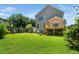 Lush backyard with a wooden fence, storage shed, and deck, offering a private and spacious outdoor retreat at 11612 Leesville Rd, Raleigh, NC 27613