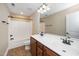 Bathroom showcasing double sinks with wooden cabinets, toilet, and shower/tub combo at 11612 Leesville Rd, Raleigh, NC 27613