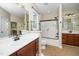 Bathroom with double vanity, tile flooring, and glass shower door at 11612 Leesville Rd, Raleigh, NC 27613
