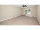 Bright bedroom with neutral walls, carpeted floor, and ceiling fan with natural light at 11612 Leesville Rd, Raleigh, NC 27613