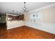 Dining room shows half wall to kitchen, large window, and overhead chandelier at 11612 Leesville Rd, Raleigh, NC 27613