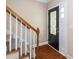 Home entryway featuring hardwood floors, stairway, and a decorative glass front door at 11612 Leesville Rd, Raleigh, NC 27613