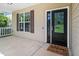 Welcoming front porch with a decorative glass door and a 'Welcome friends & Gathering' doormat at 11612 Leesville Rd, Raleigh, NC 27613