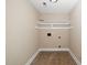 Empty storage room with shelving and tile flooring at 11612 Leesville Rd, Raleigh, NC 27613