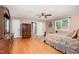 Neutral bedroom with a queen bed, dresser, and hardwood floors at 132 Lord Ashley Rd, Raleigh, NC 27610