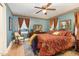 Charming bedroom with vintage-style decor, wood floors, and natural light at 132 Lord Ashley Rd, Raleigh, NC 27610