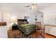 Cozy bedroom with dark wooden furniture, light purple walls and a window for natural light at 132 Lord Ashley Rd, Raleigh, NC 27610