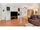 Spacious living room with hardwood floors, built in cabinets, and natural light at 132 Lord Ashley Rd, Raleigh, NC 27610