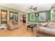 Inviting living room with hardwood floors, neutral tones, and a glimpse into adjacent rooms at 132 Lord Ashley Rd, Raleigh, NC 27610