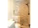 Modern tiled shower with neutral earthy tones and built-in niche at 1418 Sherron Rd, Durham, NC 27703