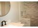 Stylish bathroom showcasing a tiled shower with a built-in niche at 1418 Sherron Rd, Durham, NC 27703