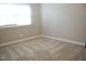 Bedroom with light carpet and natural light from a large window at 1418 Sherron Rd, Durham, NC 27703