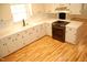 Modern kitchen featuring white cabinets, sleek countertops, and stainless steel appliances at 1418 Sherron Rd, Durham, NC 27703