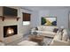 Comfortable living room with fireplace, contemporary decor, and cozy seating area at 1418 Sherron Rd, Durham, NC 27703