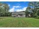 Well-maintained backyard featuring spacious lawn and deck perfect for outdoor living at 152 Abundant Ave, Angier, NC 27501